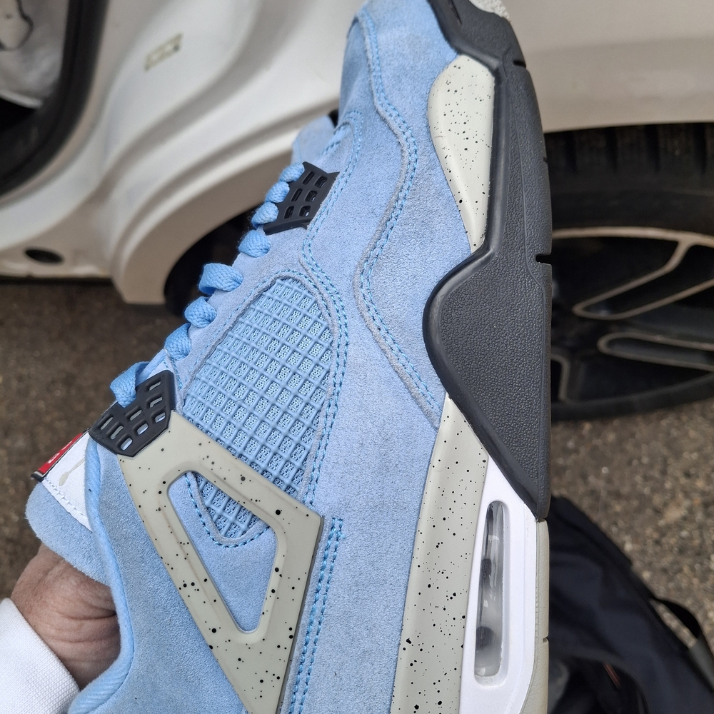 Jordan 4 Light Blue Suede Retro Sneaker with Speckled Accents